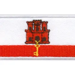 Naszywka z herbem Gibraltaru: czerwona twierdza z kluczem na białym tle i czerwonym pasie.
