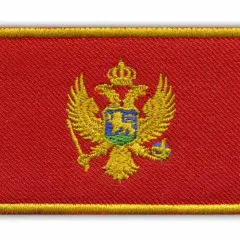 Hafciarska naszywka z godłem Czarnogóry: dwugłowy orzeł w koronie na czerwonym tle, otoczona żółtą ramką.