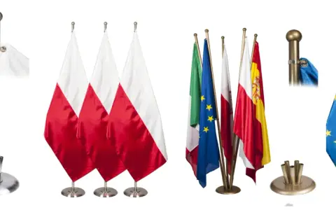 Zestaw flag narodowych i Unii Europejskiej, w tym polski proporzec, prezentowany na białym tle.