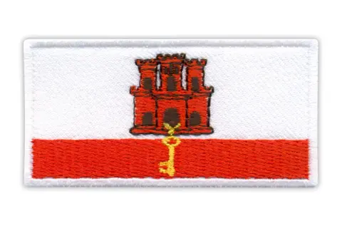 Naszywka z herbem Gibraltaru: czerwona twierdza z kluczem na białym tle i czerwonym pasie.
