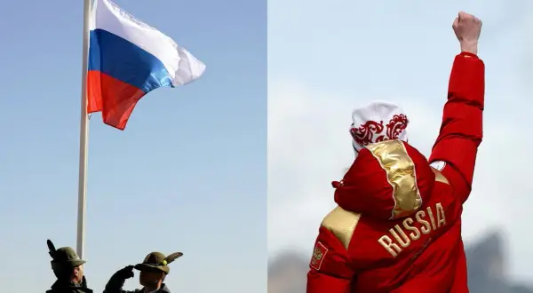 Flaga Rosji powiewa na maszcie, obok żołnierze oddają honory. Na drugim planie sportowiec w czerwonej kurtce z napisem "RUSSIA" unosi pięść w geście triumfu.