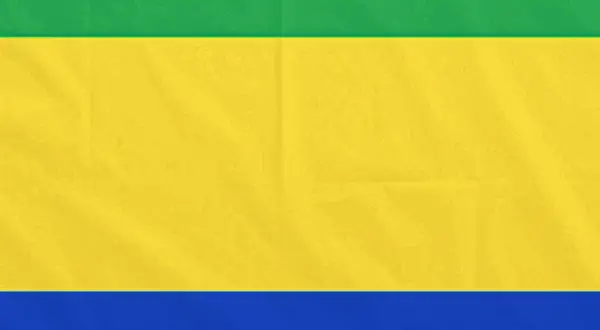 Flaga Gabonu: zielono-żółto-niebieska, symbolizująca lasy, słońce i wybrzeże.