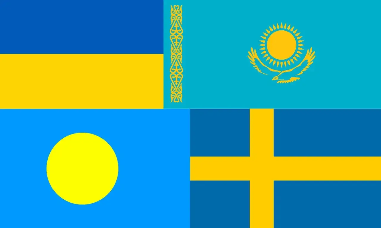 Cztery flagi: niebiesko-żółta Ukraina, Kazachstan z ornamentem i słońcem, Palau z żółtym kołem, Szwecja z krzyżem.
