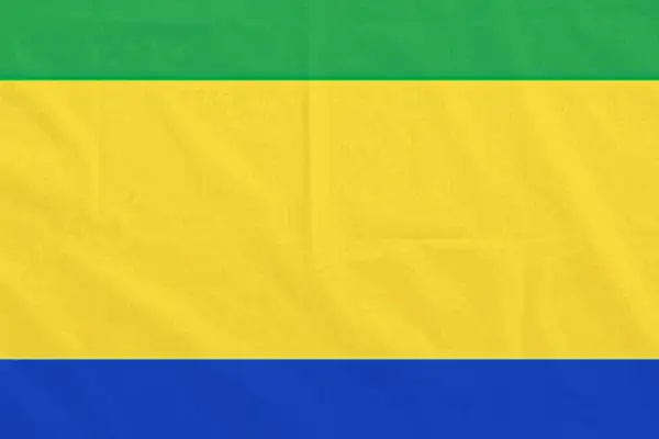 Flaga Gabonu: zielono-żółto-niebieska, symbolizująca lasy, słońce i wybrzeże.