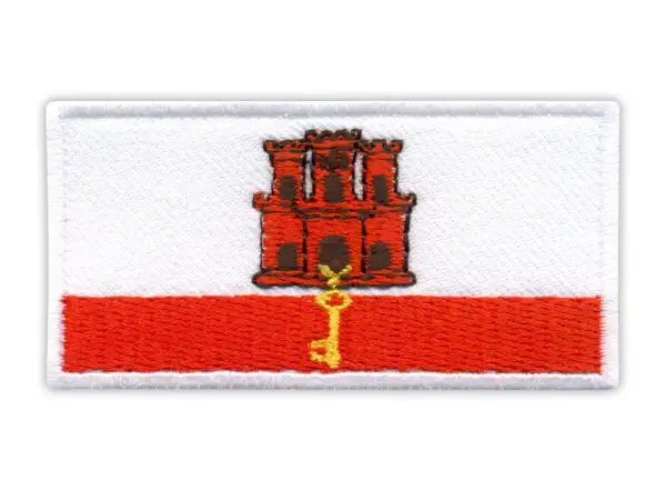 Naszywka z herbem Gibraltaru: czerwona twierdza z kluczem na białym tle i czerwonym pasie.